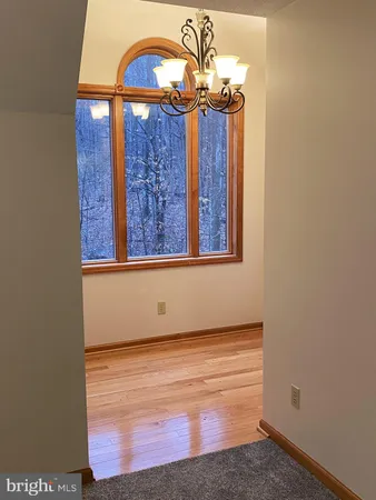 a bathroom with a toilet a sink and a mirror