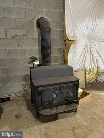 a view of a dry yard with wooden floor and fence