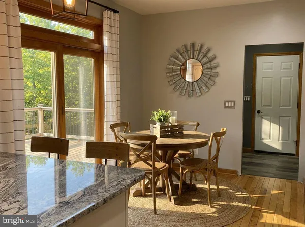 a dining room with furniture window wooden floor