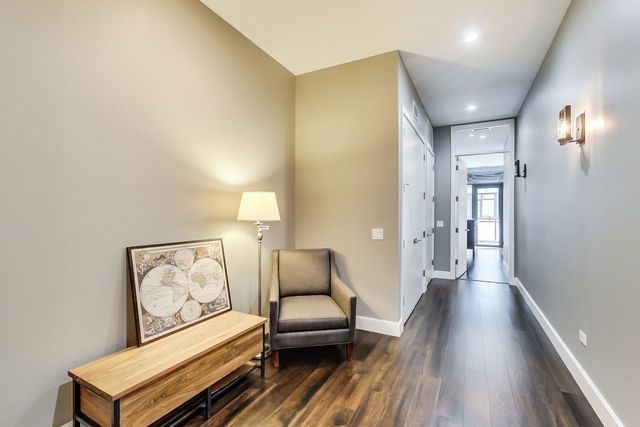 39 North Aberdeen Street, Unit 4S Chicago, IL 60607 - Photo 22 of 28 a living room with furniture and a wooden floor