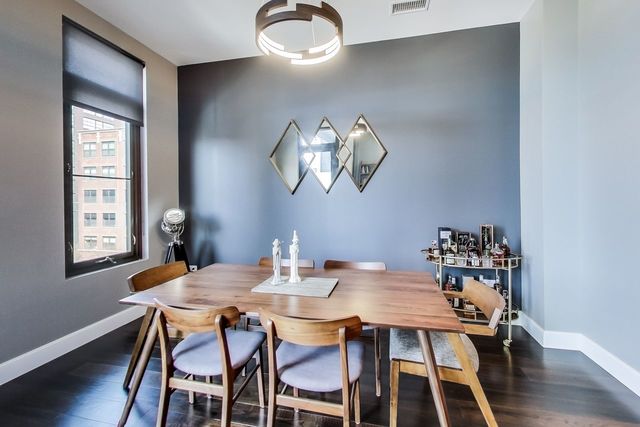 39 North Aberdeen Street, Unit 4S Chicago, IL 60607 - Photo 9 of 28 a view of a dining room with furniture and wooden floor