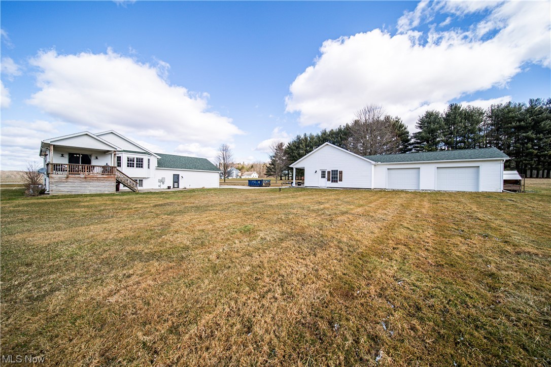 7290 Turner Road Pierpont, OH 44082 - Photo 33 of 36 View of yard featuring an outdoor structure and a garage