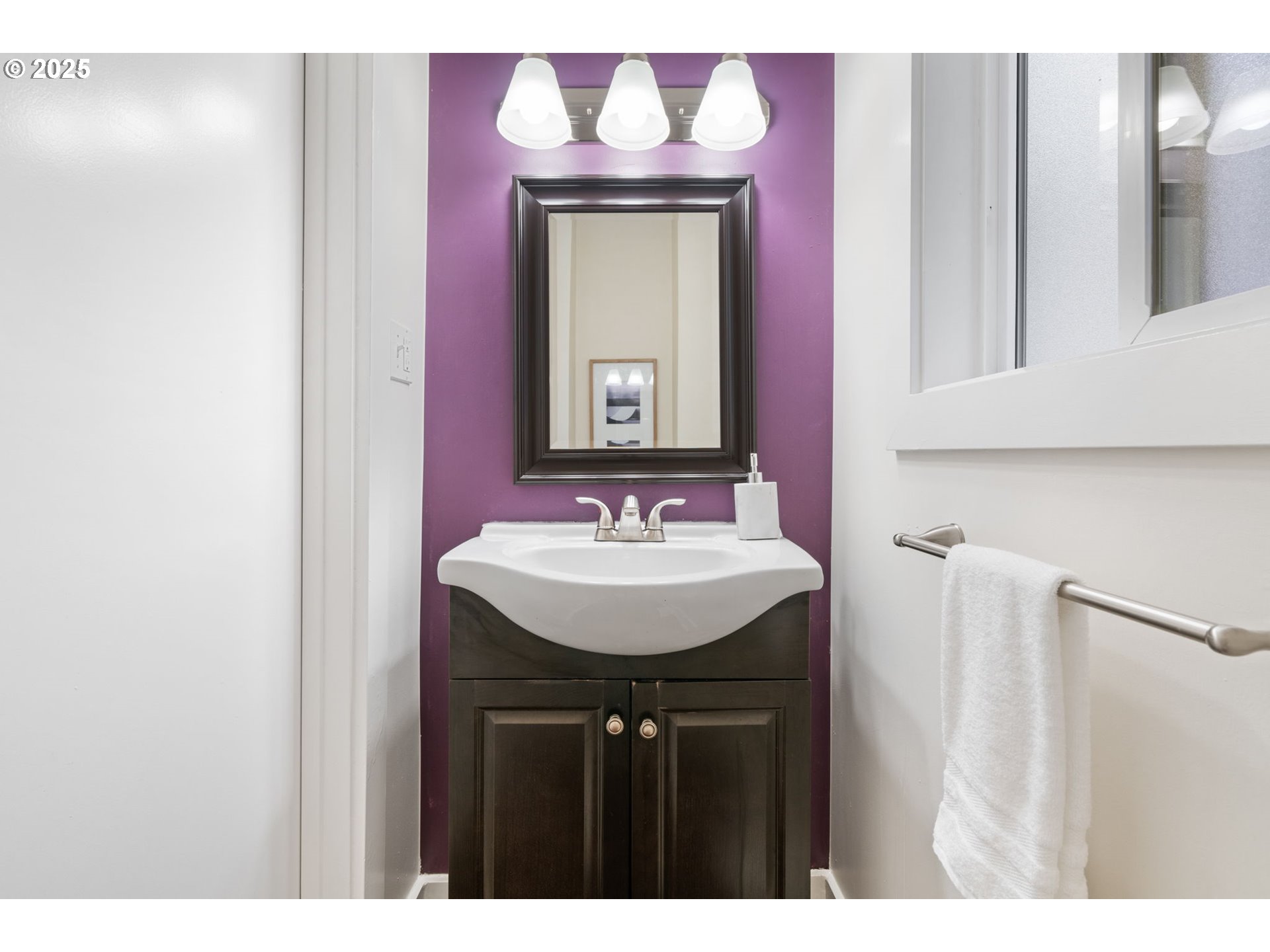 5415 Northeast 14th Place Portland, OR 97211 - Photo 15 of 38 a bathroom with a sink a mirror and a vanity