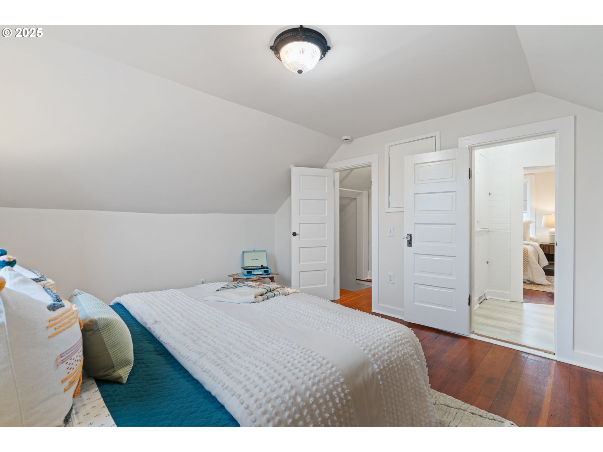 5415 Northeast 14th Place Portland, OR 97211 - Photo 22 of 38 a bedroom with a bed and a table