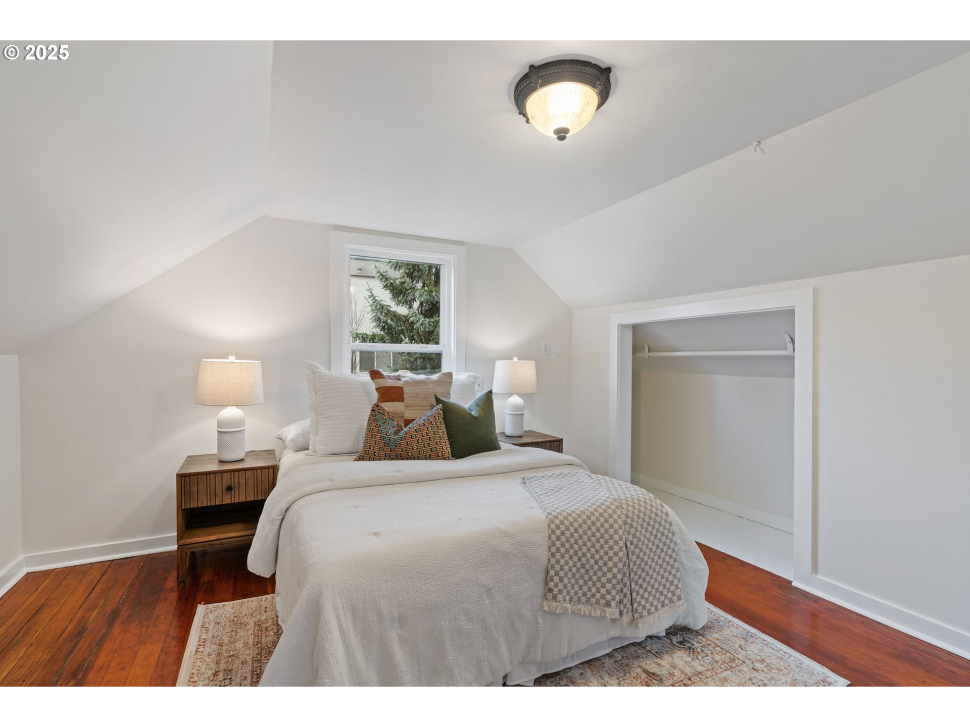 5415 Northeast 14th Place Portland, OR 97211 - Photo 24 of 38 a bedroom with a bed and a night stand