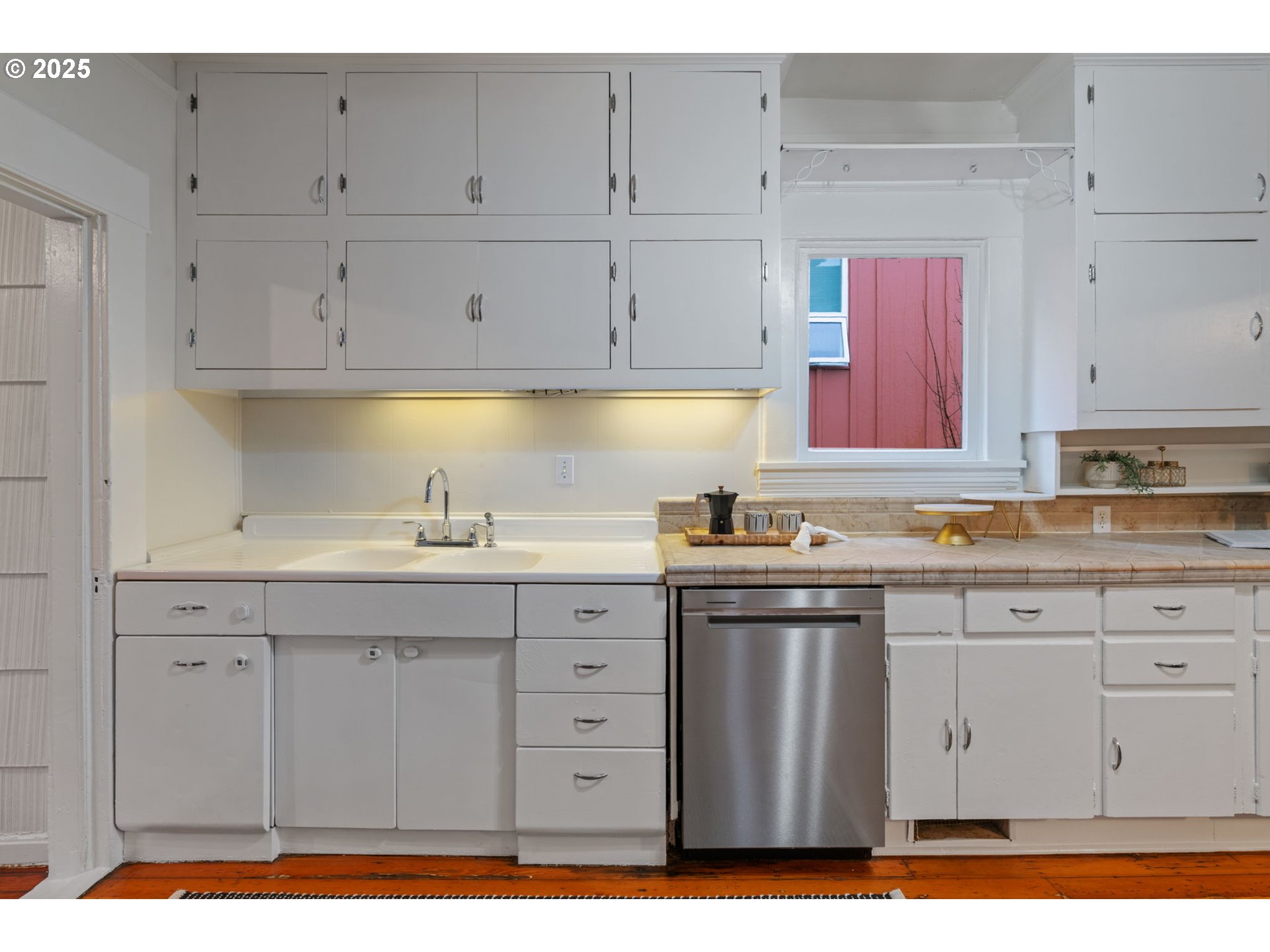 5415 Northeast 14th Place Portland, OR 97211 - Photo 9 of 38 a kitchen with granite countertop white cabinets and sink