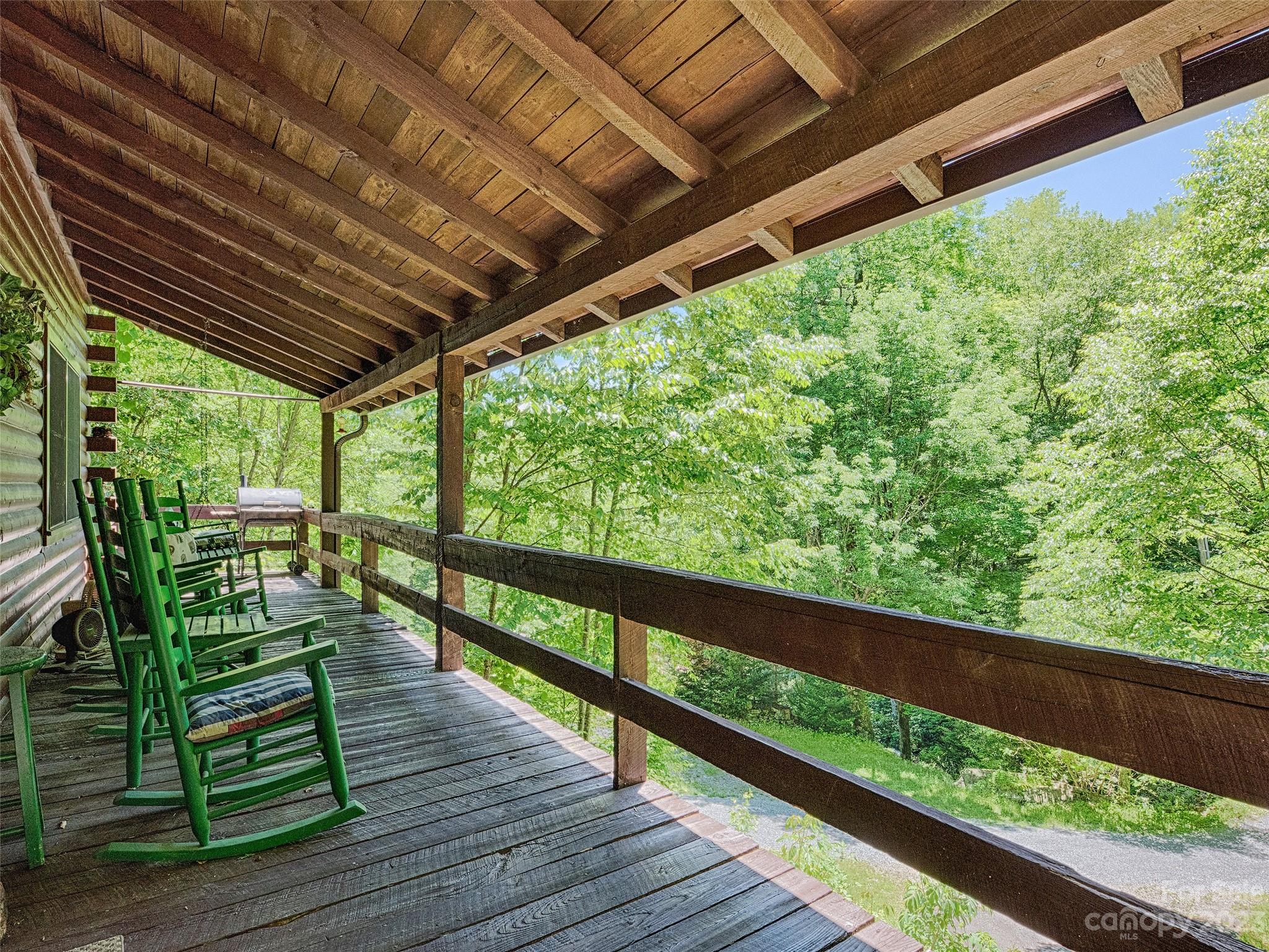 81 Railroad Grade Road Maggie Valley, NC 28751 - Photo 2 of 38 a balcony with chairs
