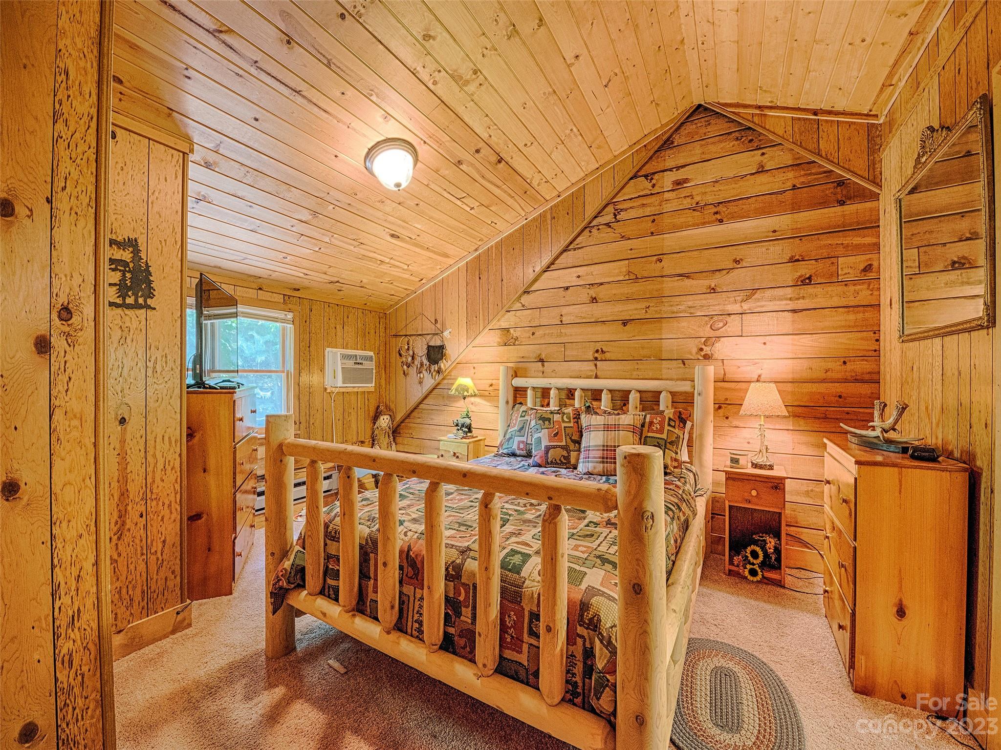 81 Railroad Grade Road Maggie Valley, NC 28751 - Photo 24 of 38 a view of a porch with wooden floor and fence