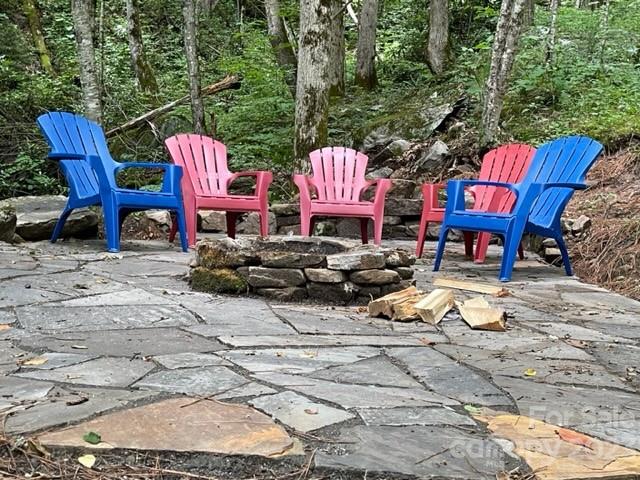 81 Railroad Grade Road Maggie Valley, NC 28751 - Photo 30 of 38 a view of a chairs and tables in the patio