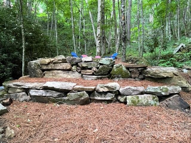 81 Railroad Grade Road Maggie Valley, NC 28751 - Photo 31 of 38 a group of couches sitting in a backyard
