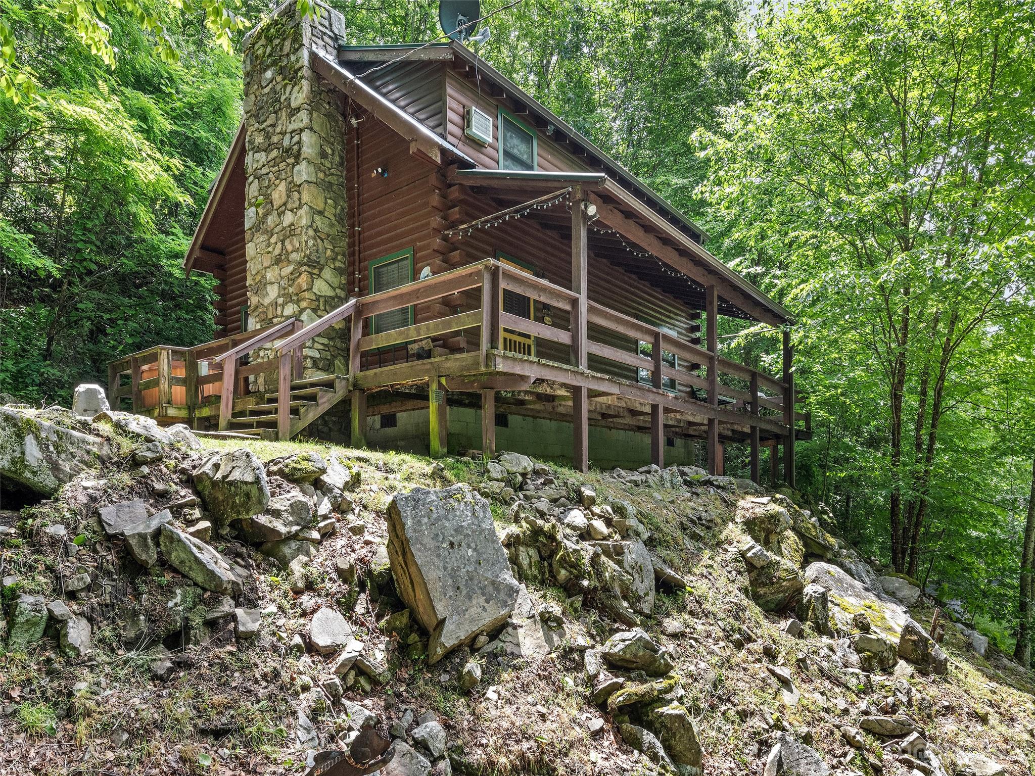 81 Railroad Grade Road Maggie Valley, NC 28751 - Photo 35 of 38 a house with trees in front of it
