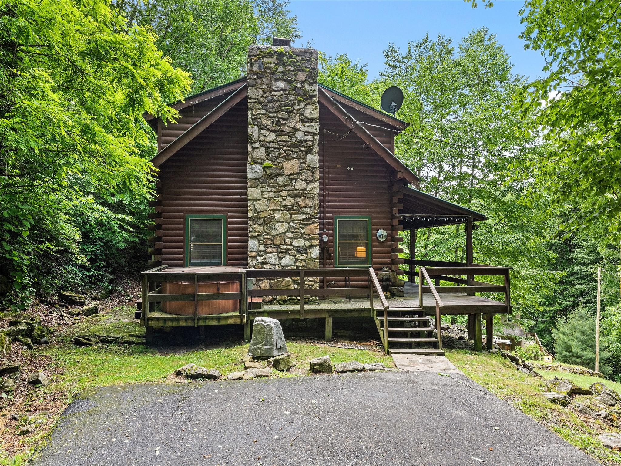 81 Railroad Grade Road Maggie Valley, NC 28751 - Photo 36 of 38 a view of house with outdoor seating area
