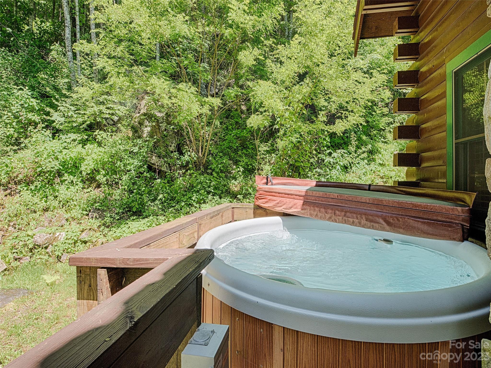 81 Railroad Grade Road Maggie Valley, NC 28751 - Photo 5 of 38 a view of a balcony with chairs