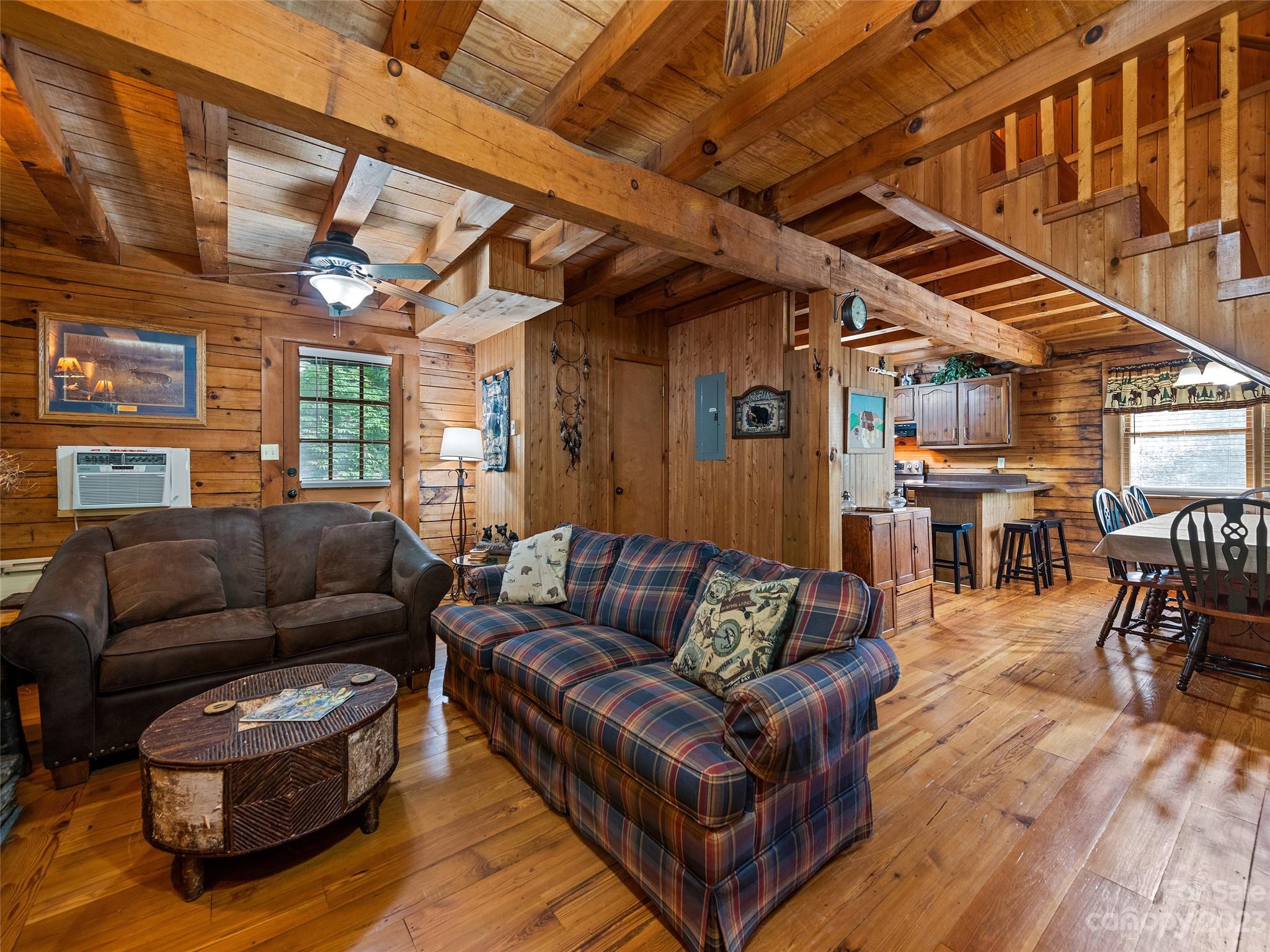 81 Railroad Grade Road Maggie Valley, NC 28751 - Photo 9 of 38 a living room with furniture and a wooden floor