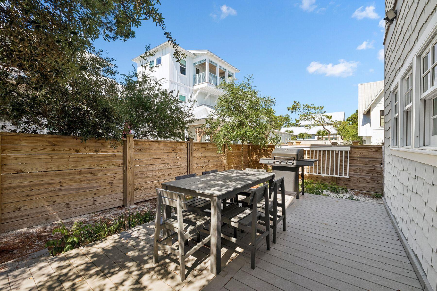 39 Willow Mist Road Inlet Beach, FL 32461 - Photo 28 of 41 a view of a dinning table and chairs on the roof deck