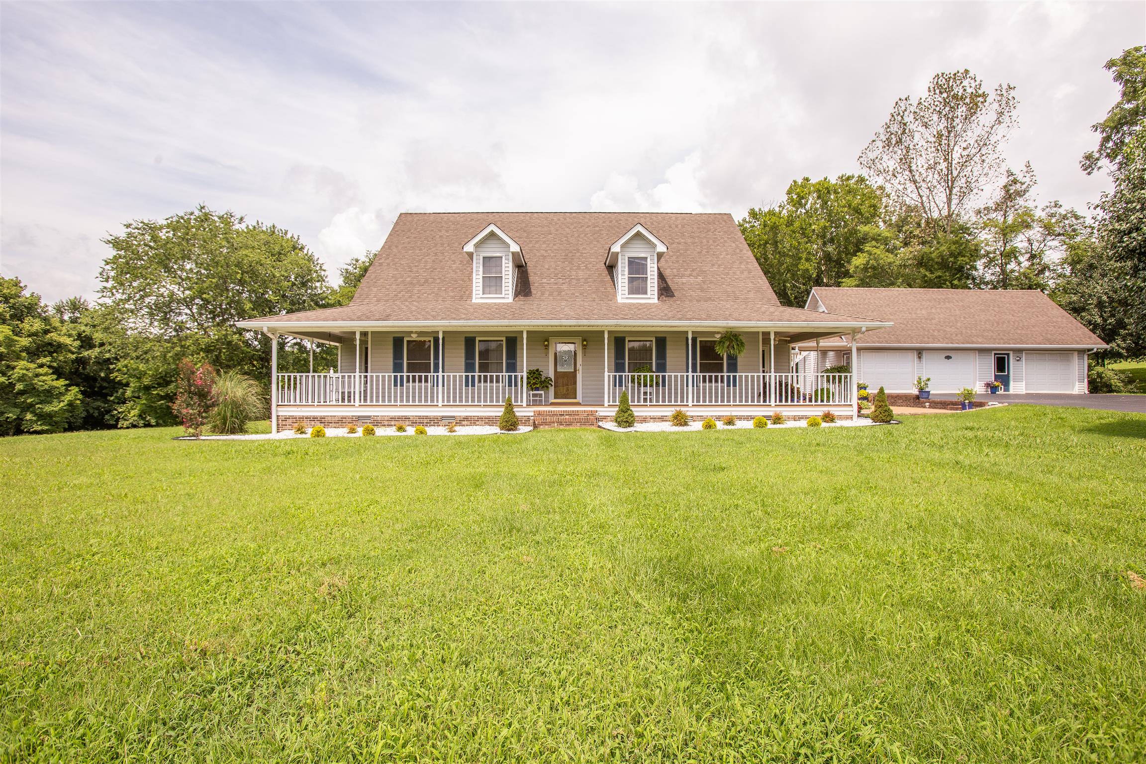 1157 Roseland Road Columbia, TN 38401 - Photo 1 of 30 a view of a large building with a big yard and large trees