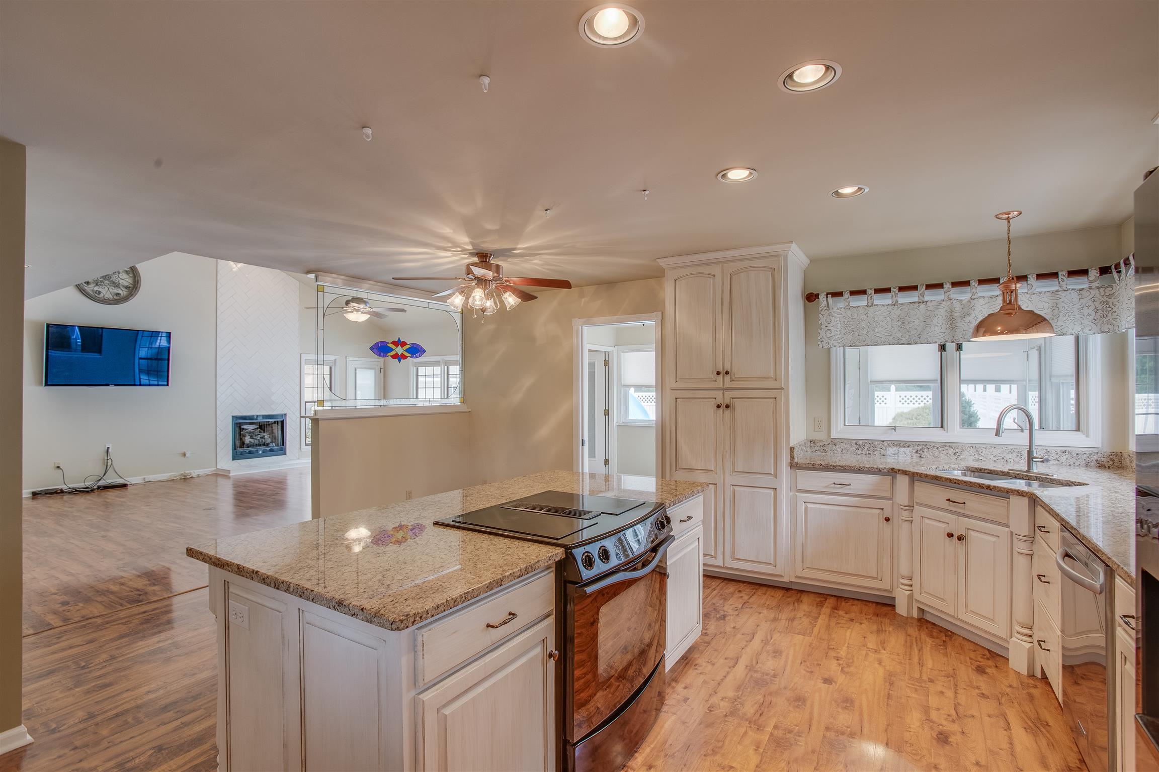 1157 Roseland Road Columbia, TN 38401 - Photo 12 of 30 a kitchen with granite countertop a sink stove and refrigerator