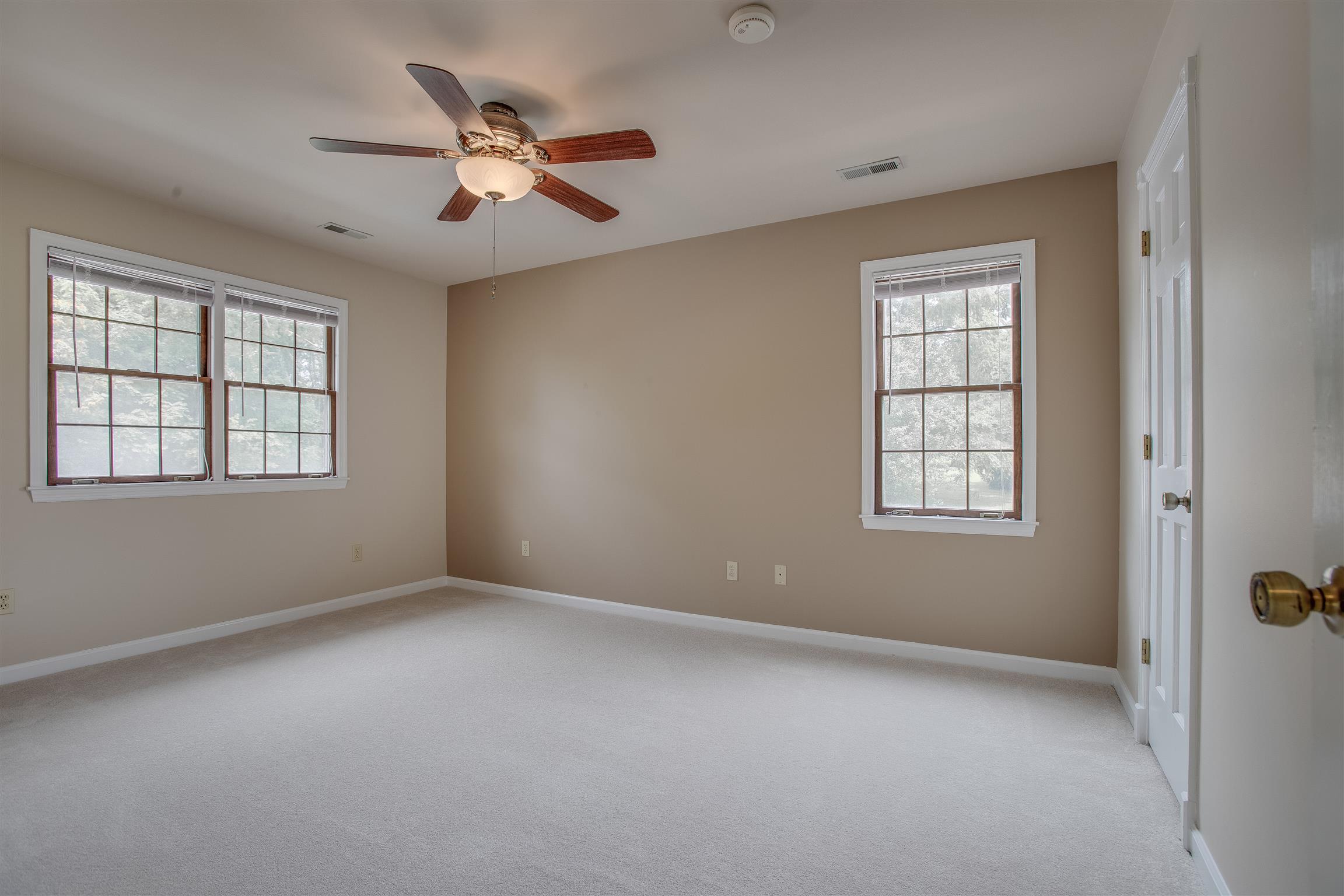 1157 Roseland Road Columbia, TN 38401 - Photo 20 of 30 an empty room with ceiling fan and windows