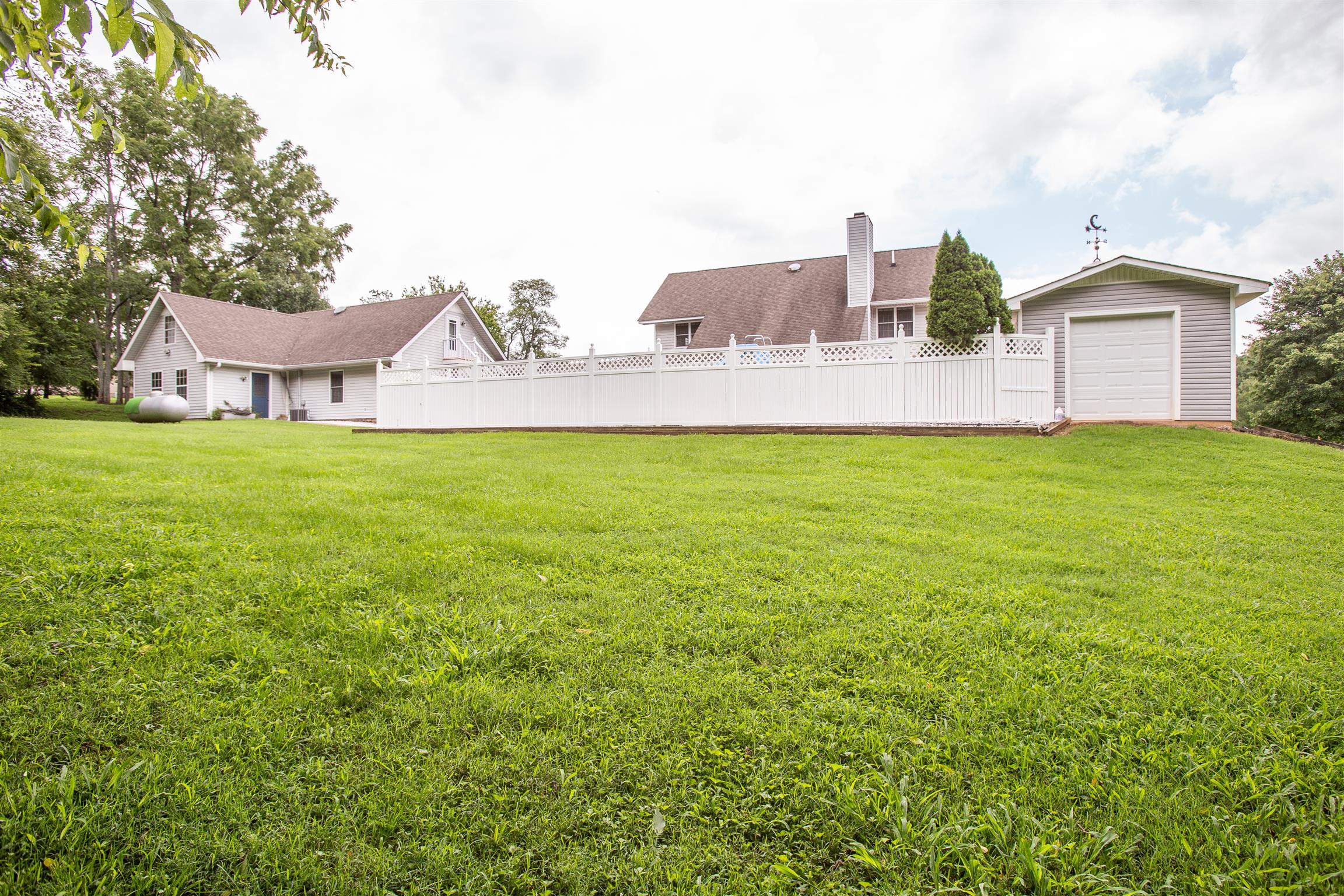 1157 Roseland Road Columbia, TN 38401 - Photo 27 of 30 a view of a house with a yard and a garage