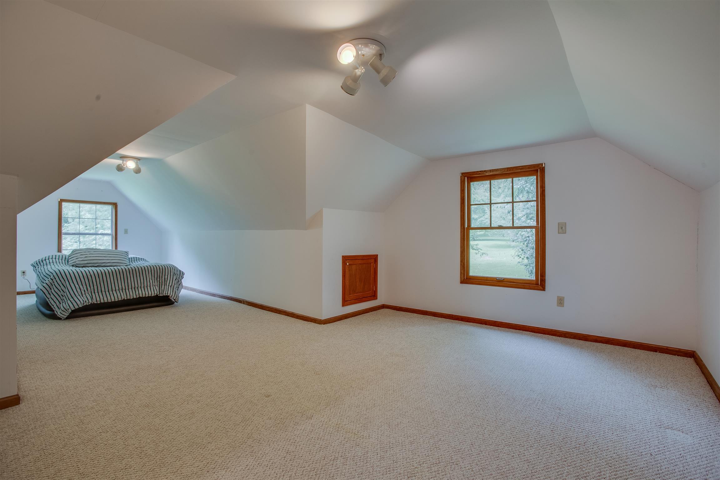 1157 Roseland Road Columbia, TN 38401 - Photo 29 of 30 an empty room with windows and fireplace
