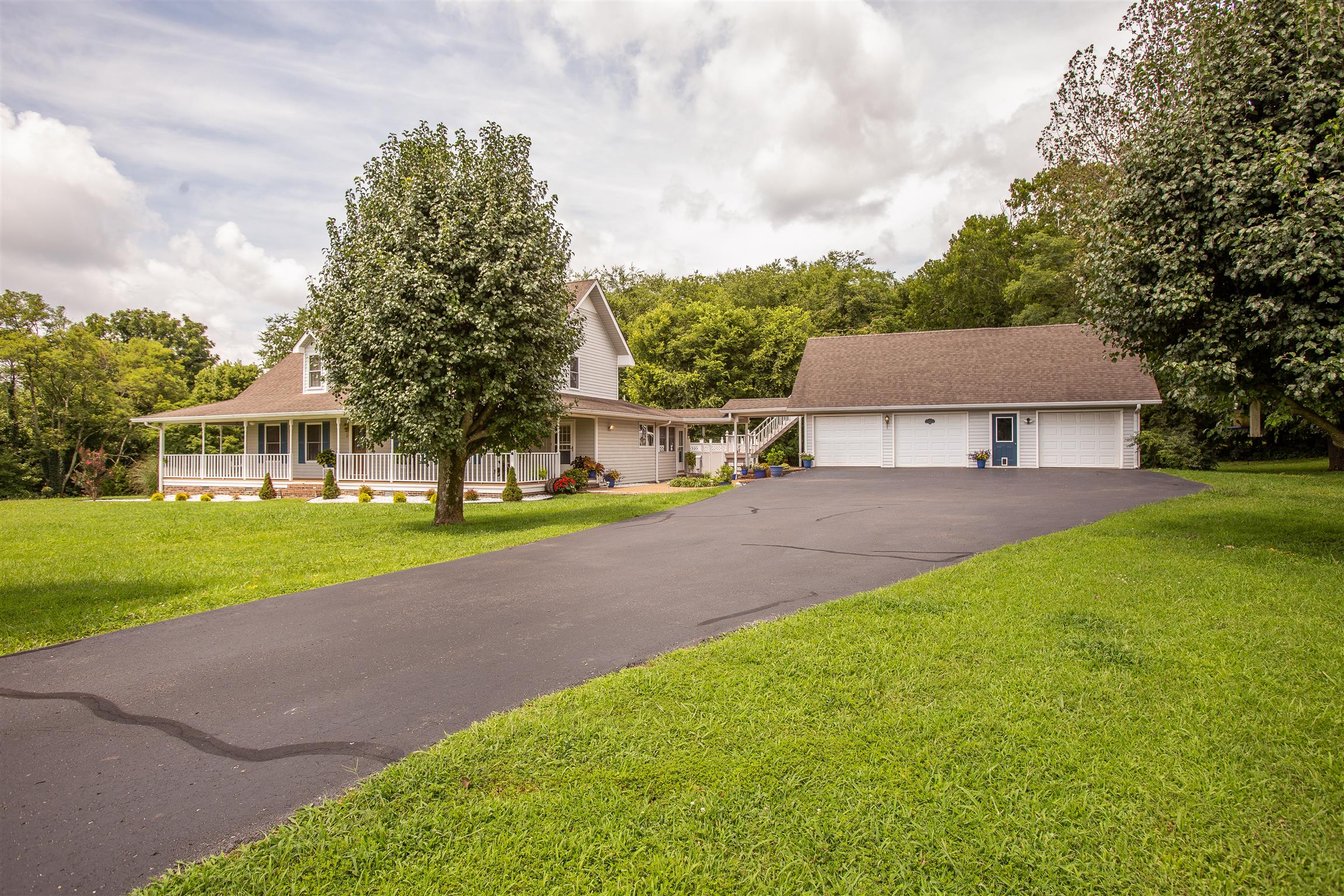 1157 Roseland Road Columbia, TN 38401 - Photo 4 of 30 a front view of a house with a yard and garage