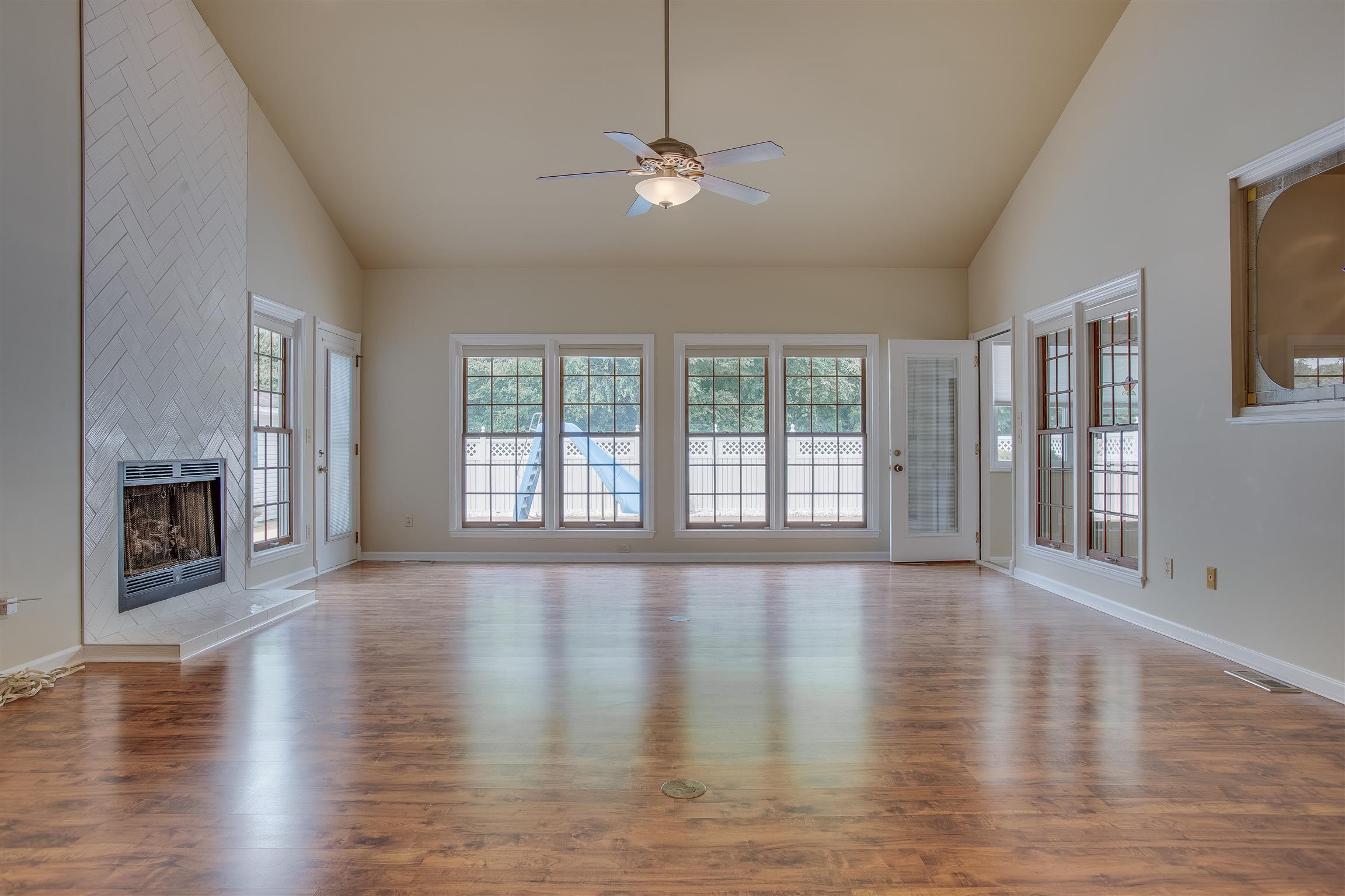 1157 Roseland Road Columbia, TN 38401 - Photo 8 of 30 a view of an empty room with window and wooden floor