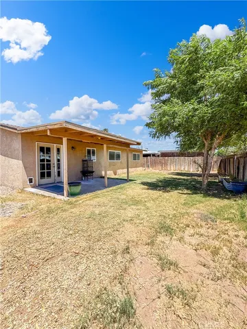 a view of a house with a yard and garage