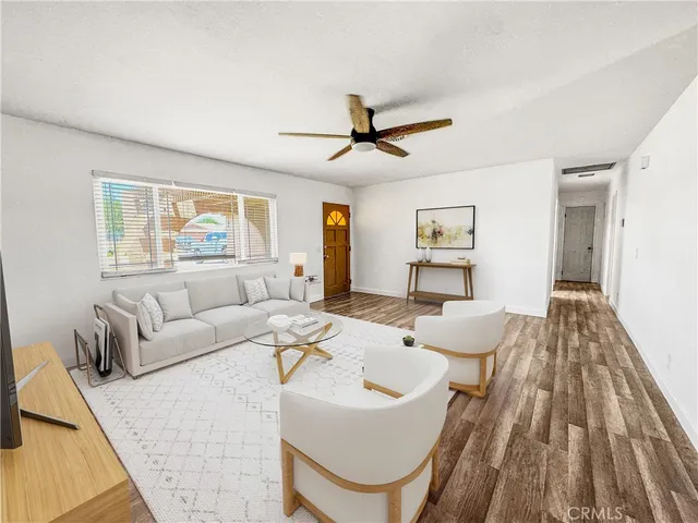 a living room with furniture and a table