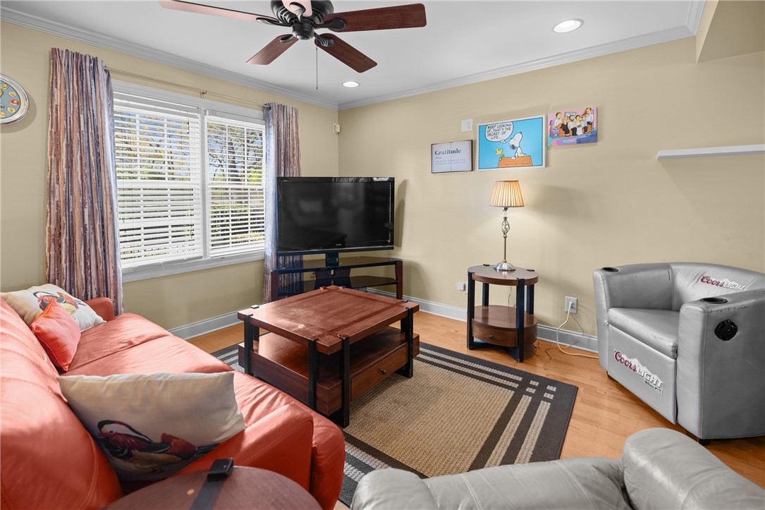 209 Calhoun Street, Unit 201 Clemson, SC 29631 - Photo 6 of 35 This inviting living space features warm hardwood floors and a window offering natural light.