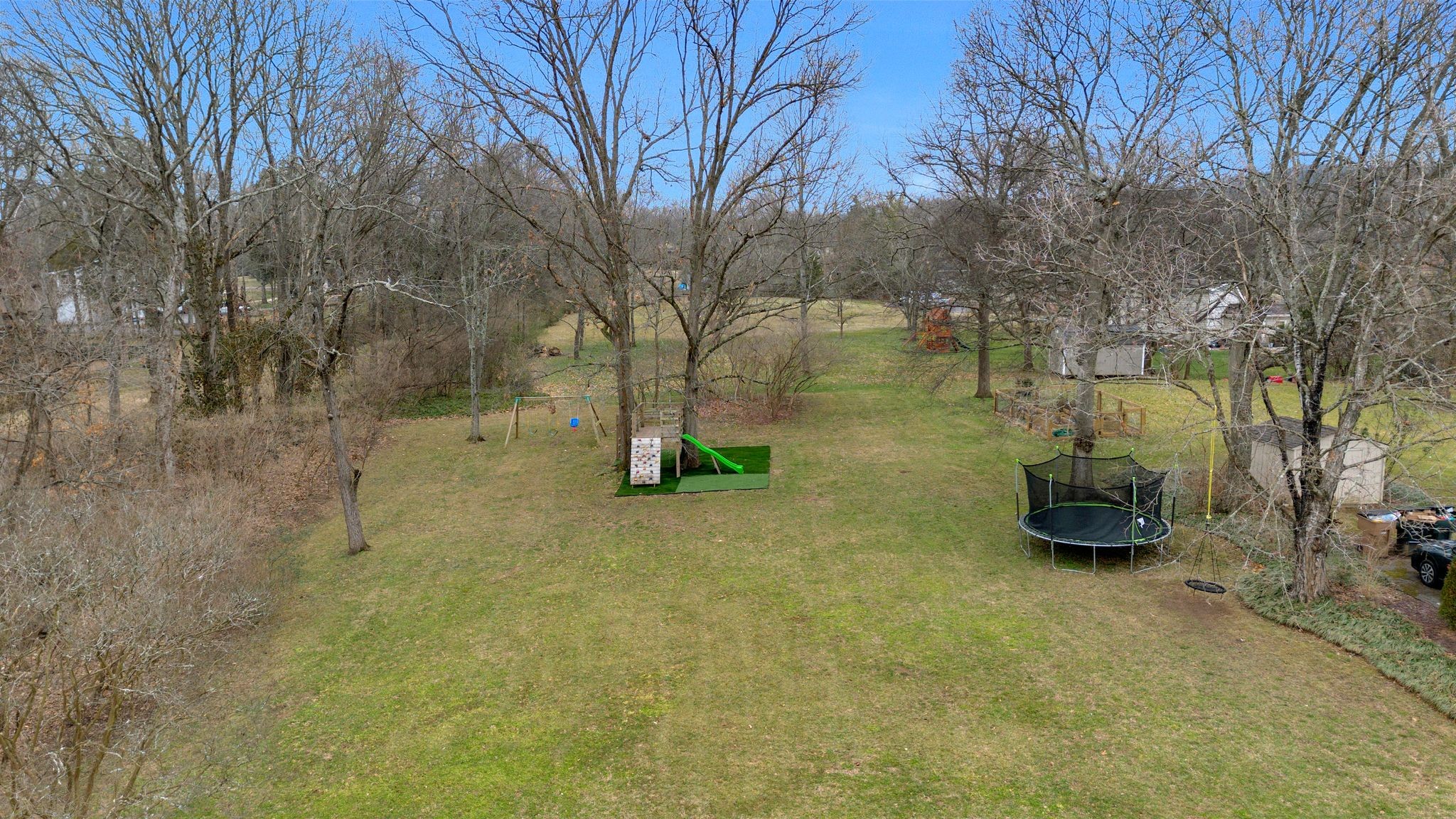 711 Davidson Road Nashville, TN 37205 - Photo 17 of 22 a backyard of a house with lots of green space