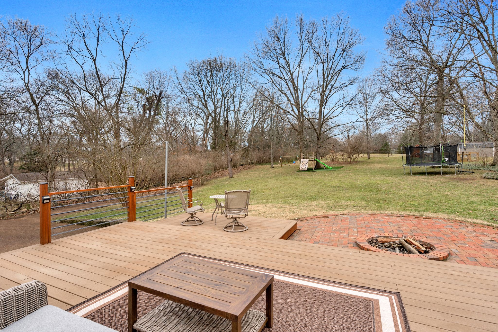 711 Davidson Road Nashville, TN 37205 - Photo 8 of 22 a view of a patio with table and chairs and wooden fence