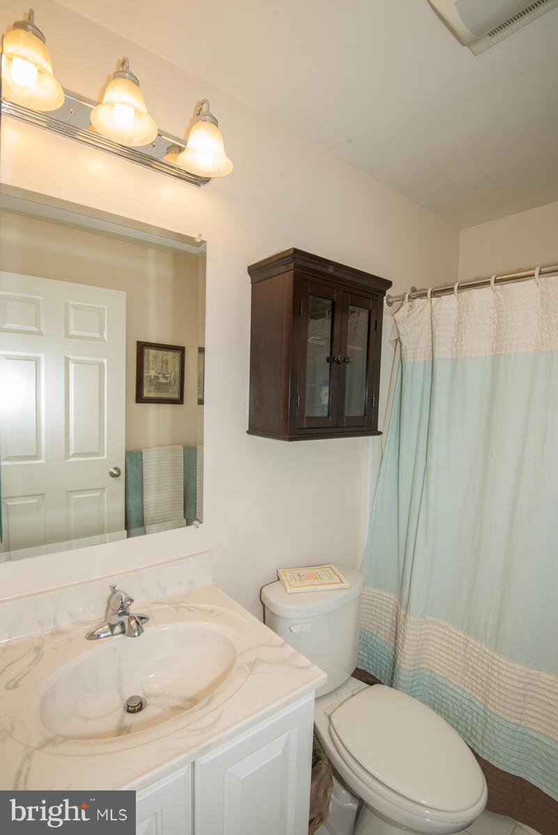 1325 Tree Side Court Odenton, MD 21113 - Photo 15 of 20 a bathroom with a sink toilet and shower