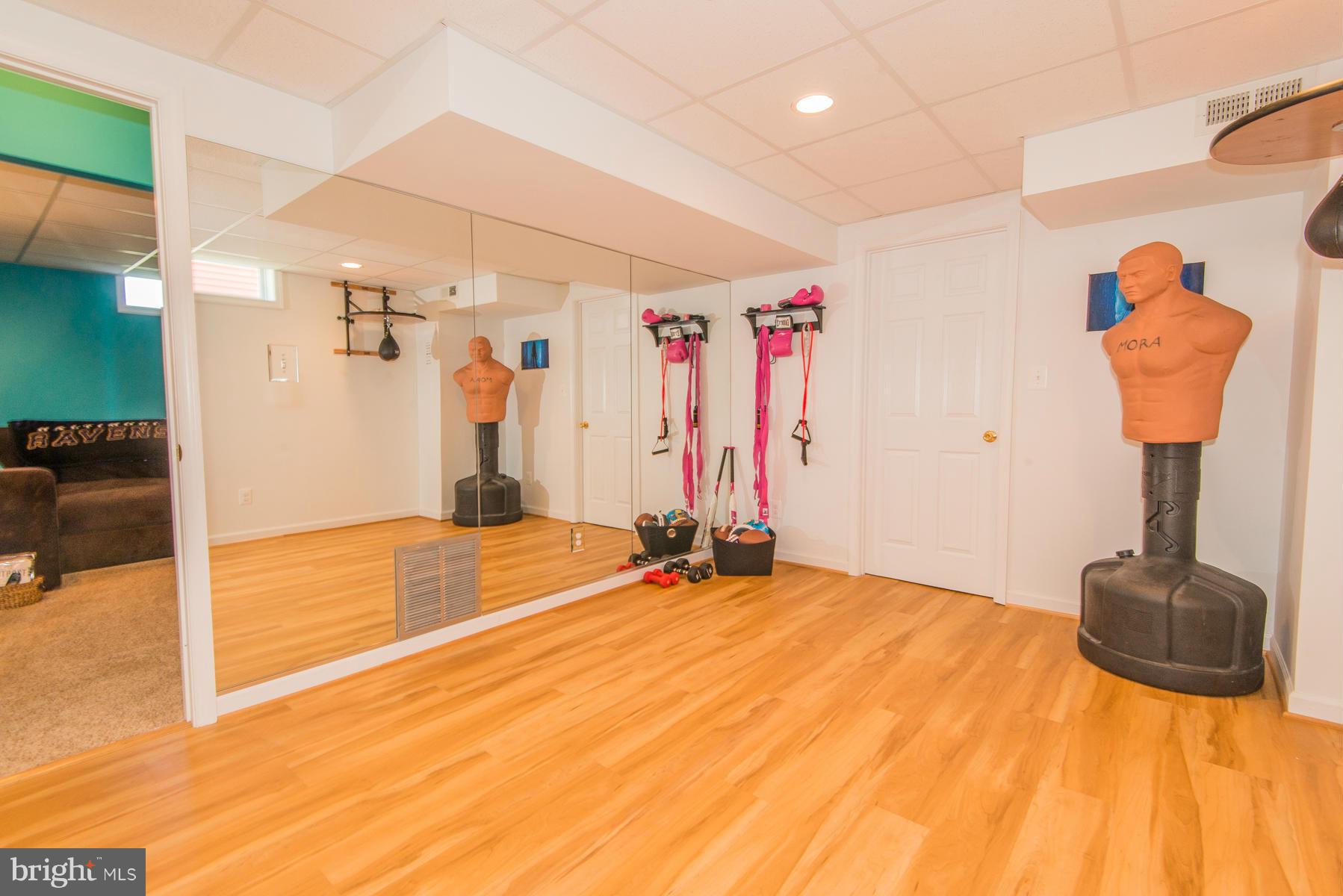 1325 Tree Side Court Odenton, MD 21113 - Photo 16 of 20 a bedroom with a bed and a mirror