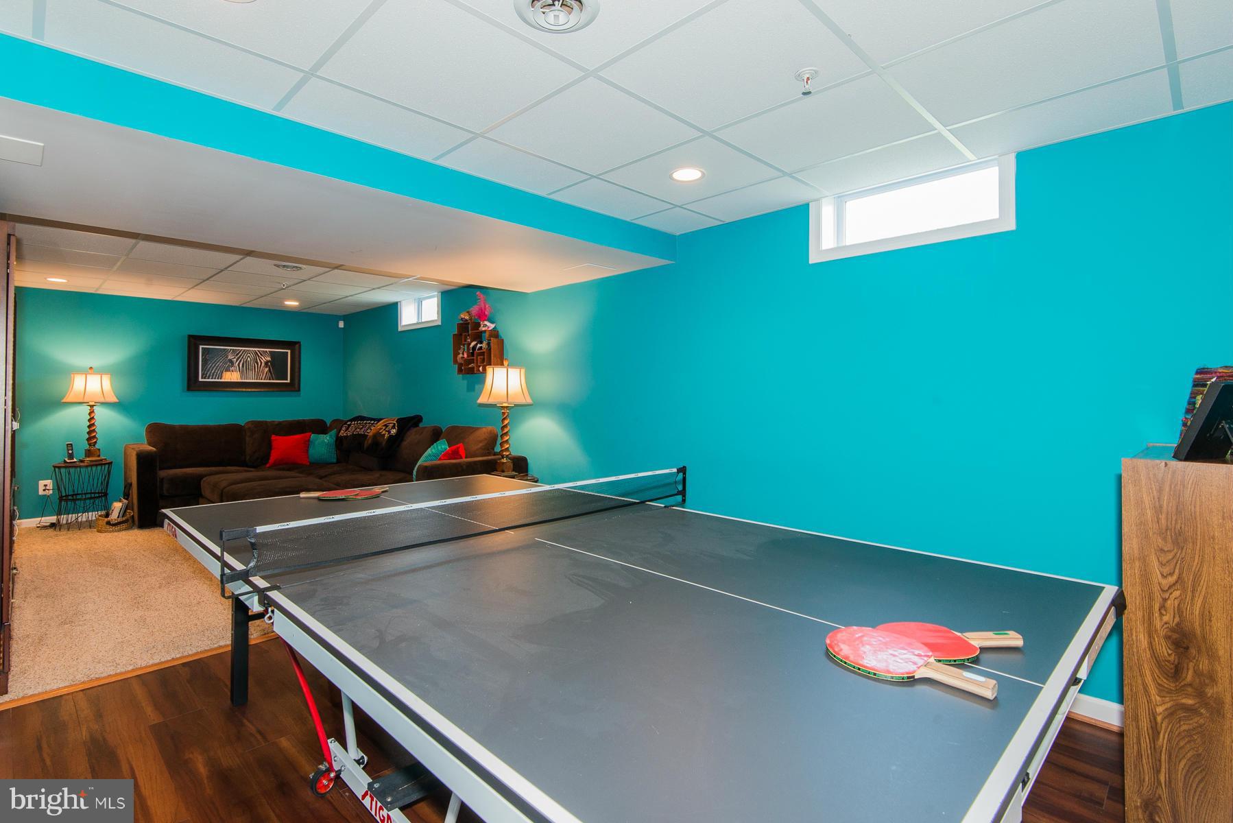 1325 Tree Side Court Odenton, MD 21113 - Photo 18 of 20 a room with furniture and a potted plant