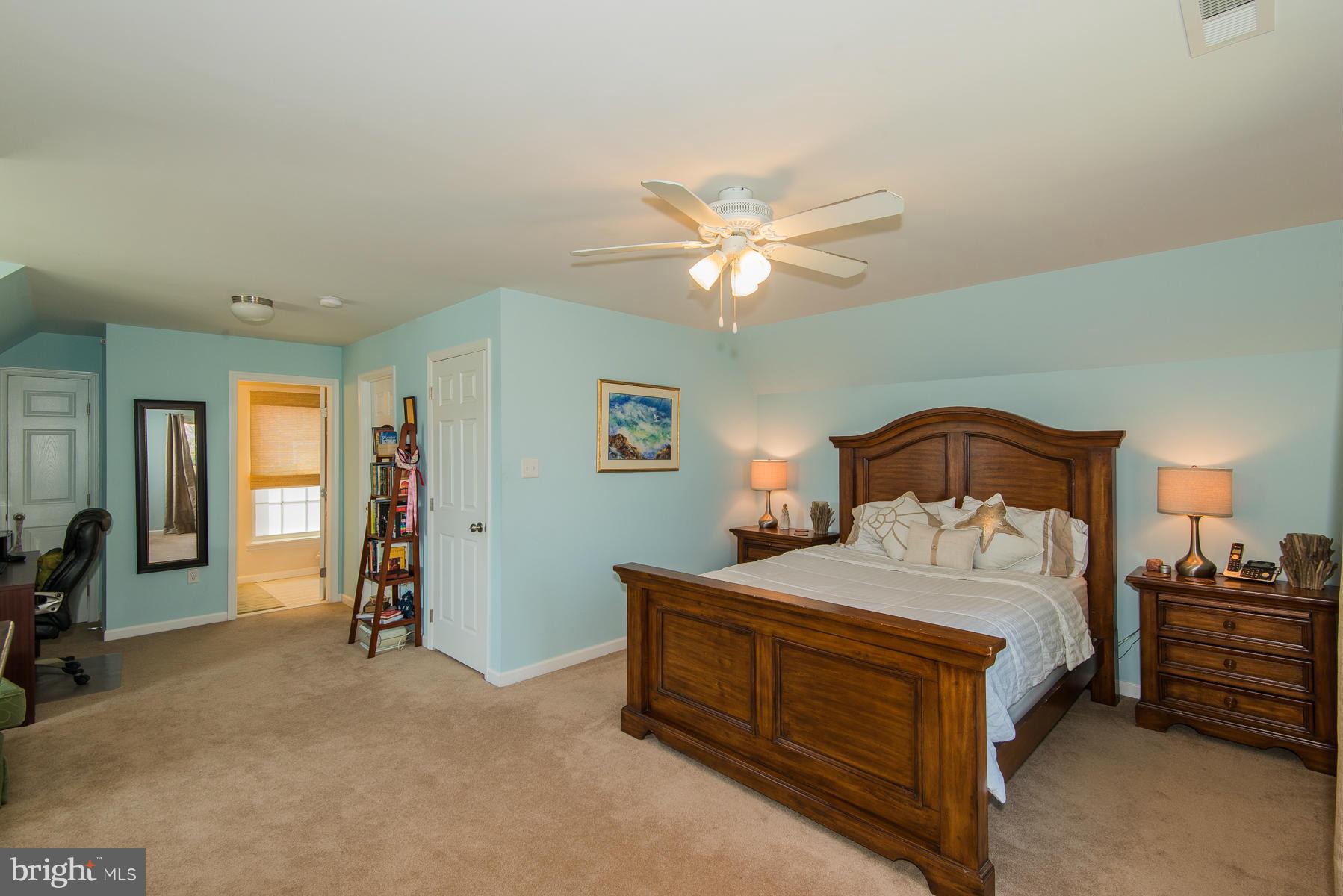 1325 Tree Side Court Odenton, MD 21113 - Photo 4 of 20 a bedroom with a bed and a chandelier