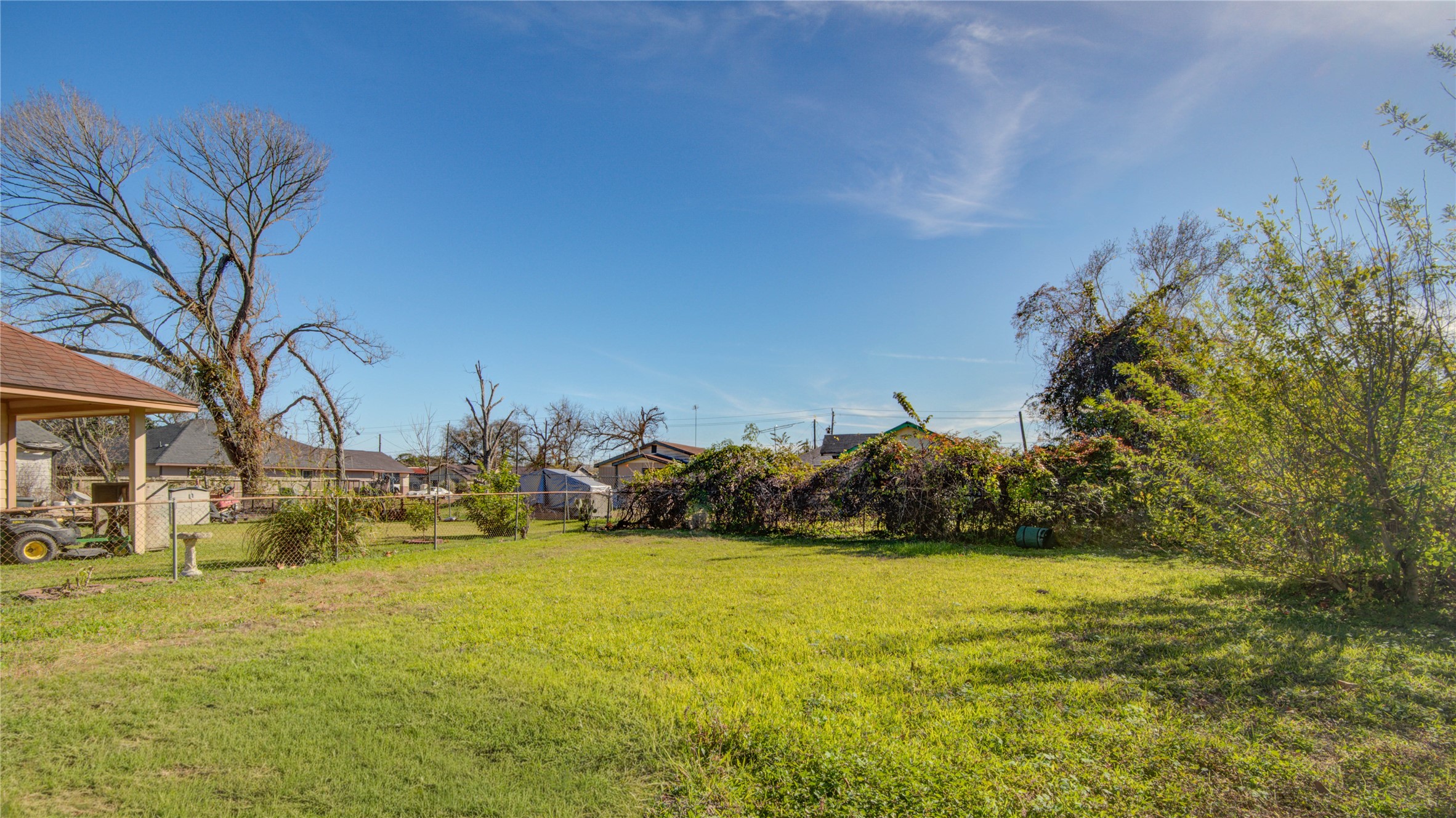 207 East Bernard Street Clute, TX 77531 - Photo 22 of 25 a view of yard with swimming pool and green space