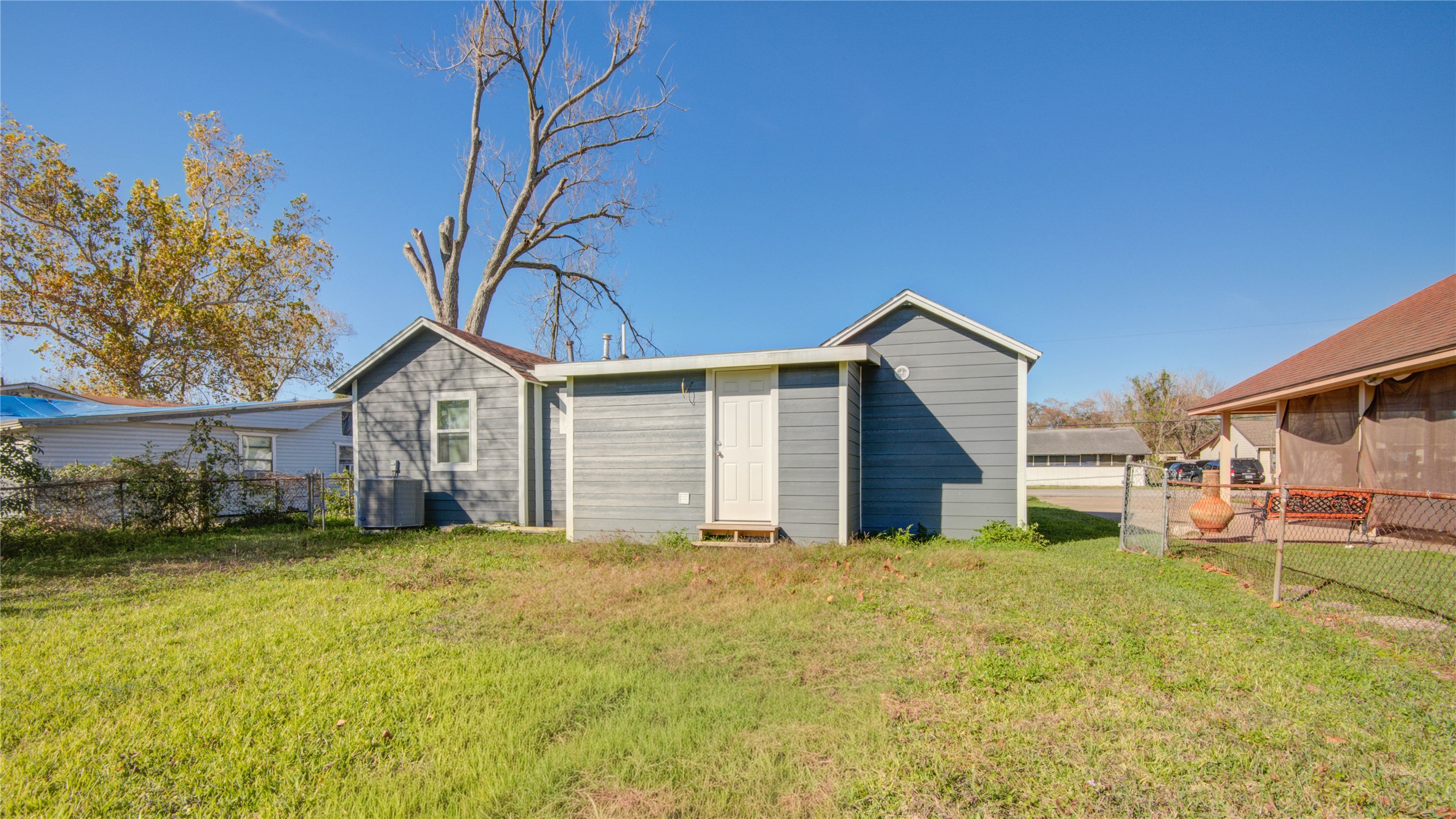 207 East Bernard Street Clute, TX 77531 - Photo 23 of 25 a view of a house with a yard and garage