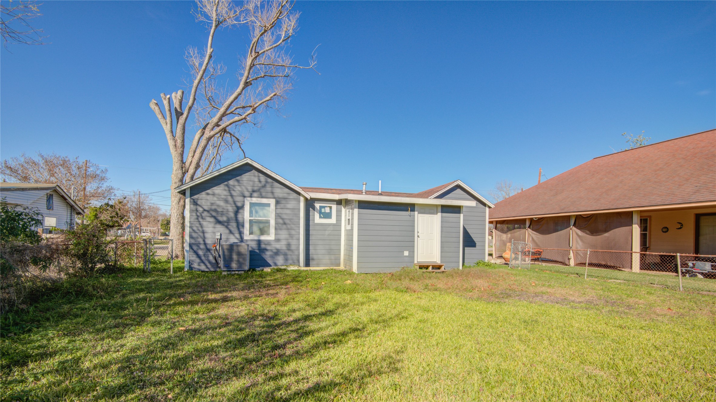207 East Bernard Street Clute, TX 77531 - Photo 25 of 25 a front view of a house with a big yard
