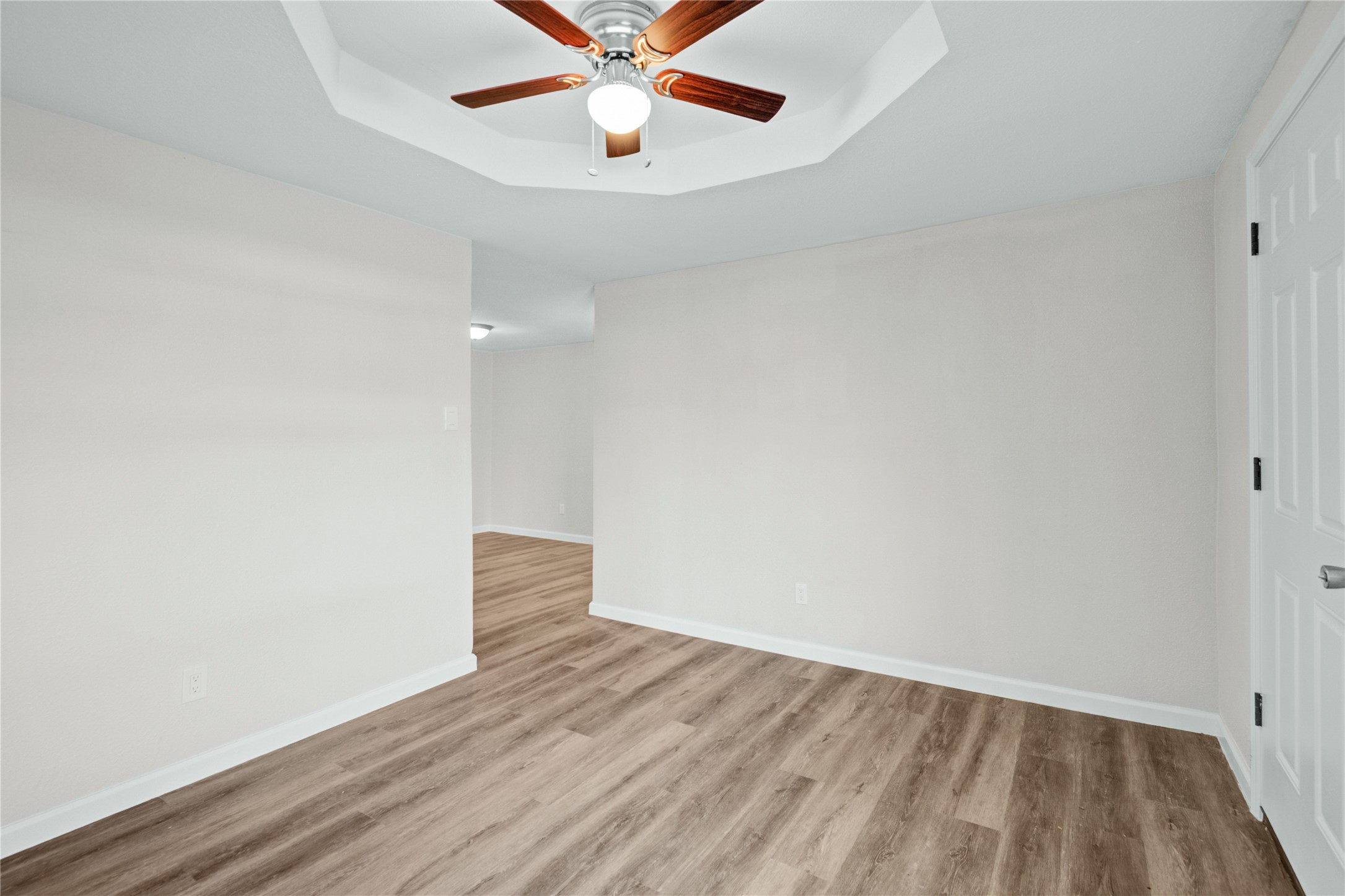 207 East Bernard Street Clute, TX 77531 - Photo 7 of 25 wooden floor in an empty room with a window