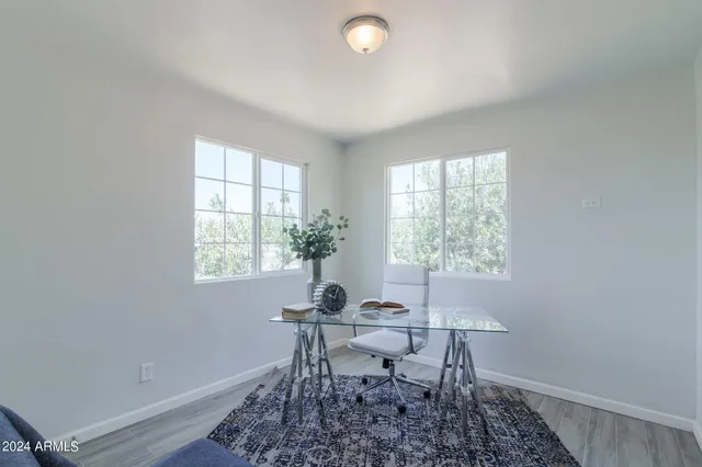 a workspace with furniture and a window