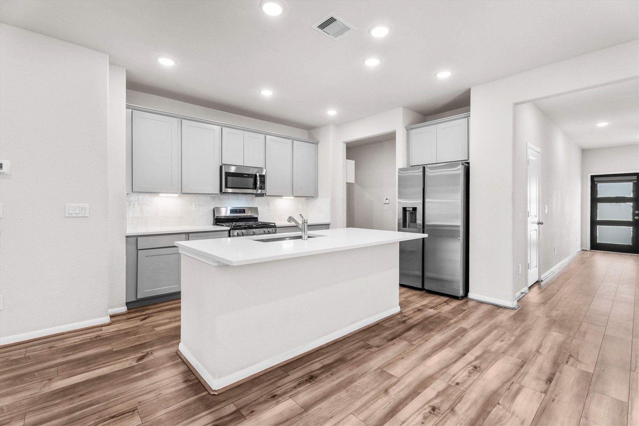 39 Courageous Side Way Magnolia, TX 77354 - Photo 6 of 44 Luxury vinyl plank flooring, quartz/silestone countertops, and upgraded kitchens common in many Davidson Homes