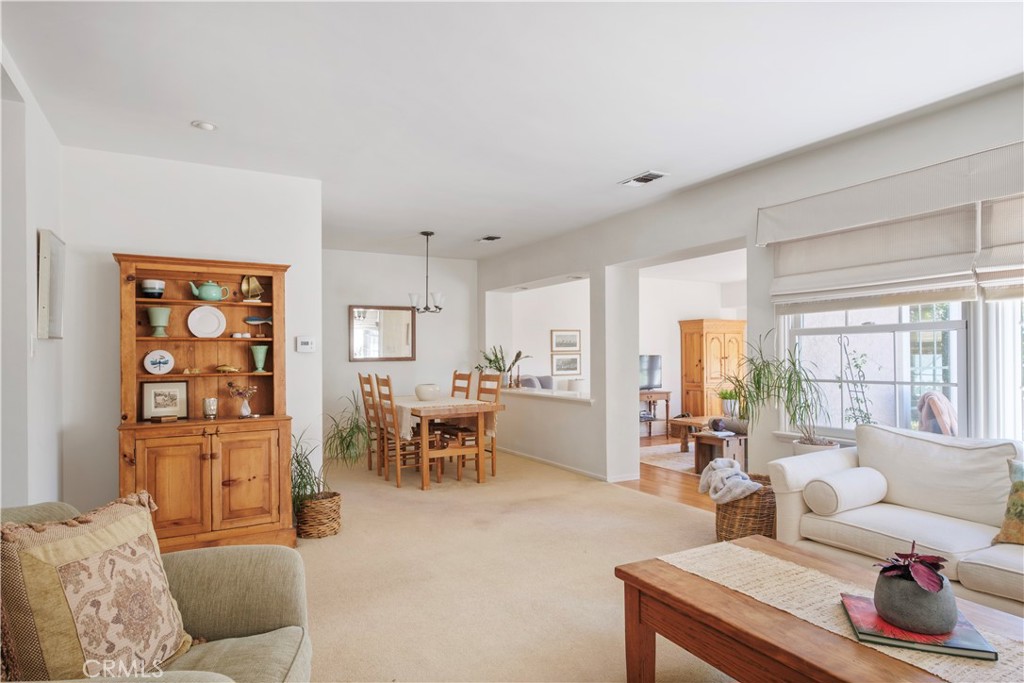 1907 Amber Lane Burbank, CA 91504 - Photo 5 of 25 a living room with furniture and a dining table with kitchen view