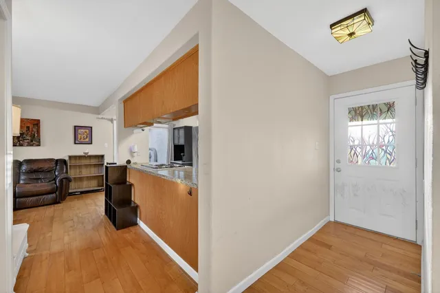 a view of a living room with furniture and a flat screen tv