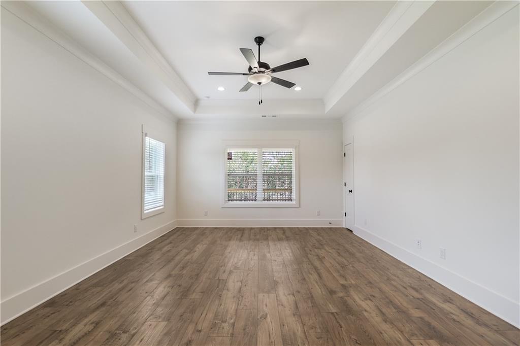 2113 Stonegate Way Monroe, GA 30656 - Photo 26 of 43 wooden floor in an empty room with a window