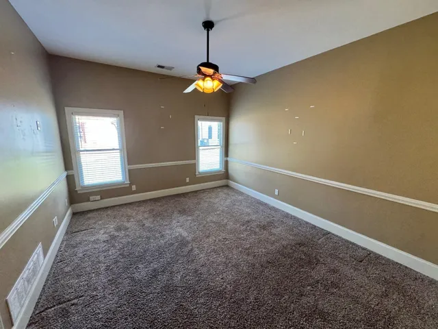 an empty room with mirror