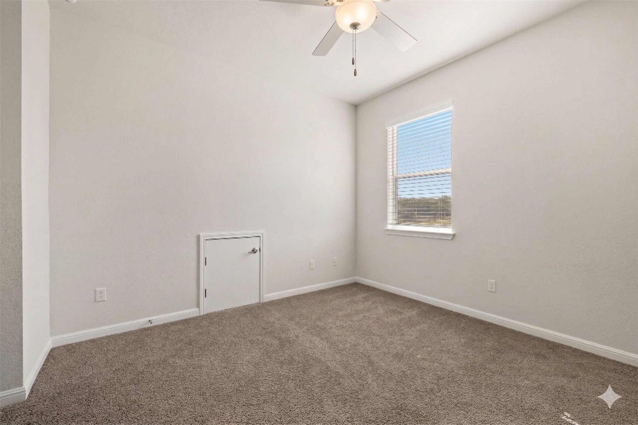 604 Spindrift Lane Leander, TX 78641 - Photo 17 of 32 an empty room with a chandelier fan and windows