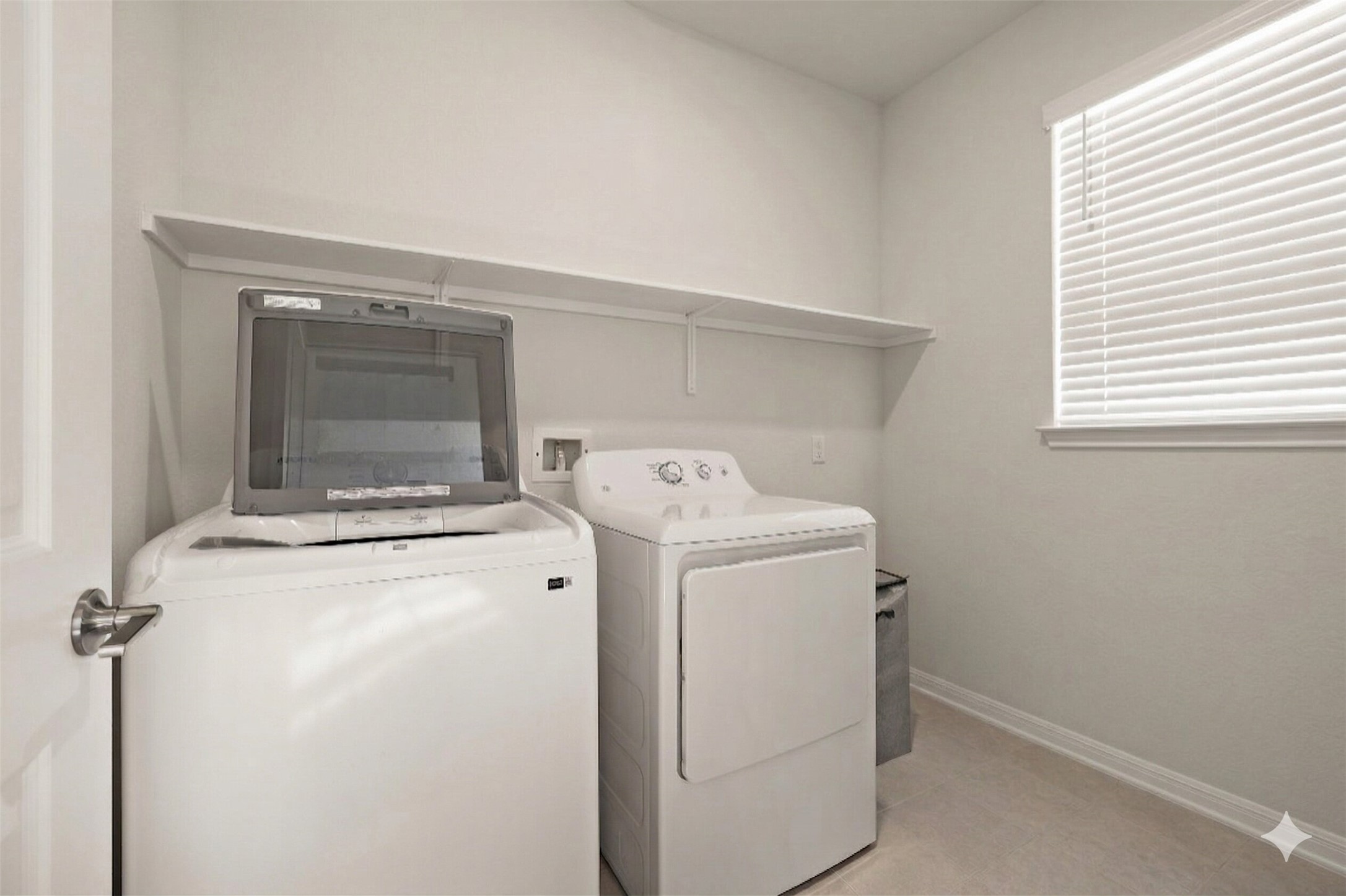 604 Spindrift Lane Leander, TX 78641 - Photo 26 of 32 a utility room with dryer and washer