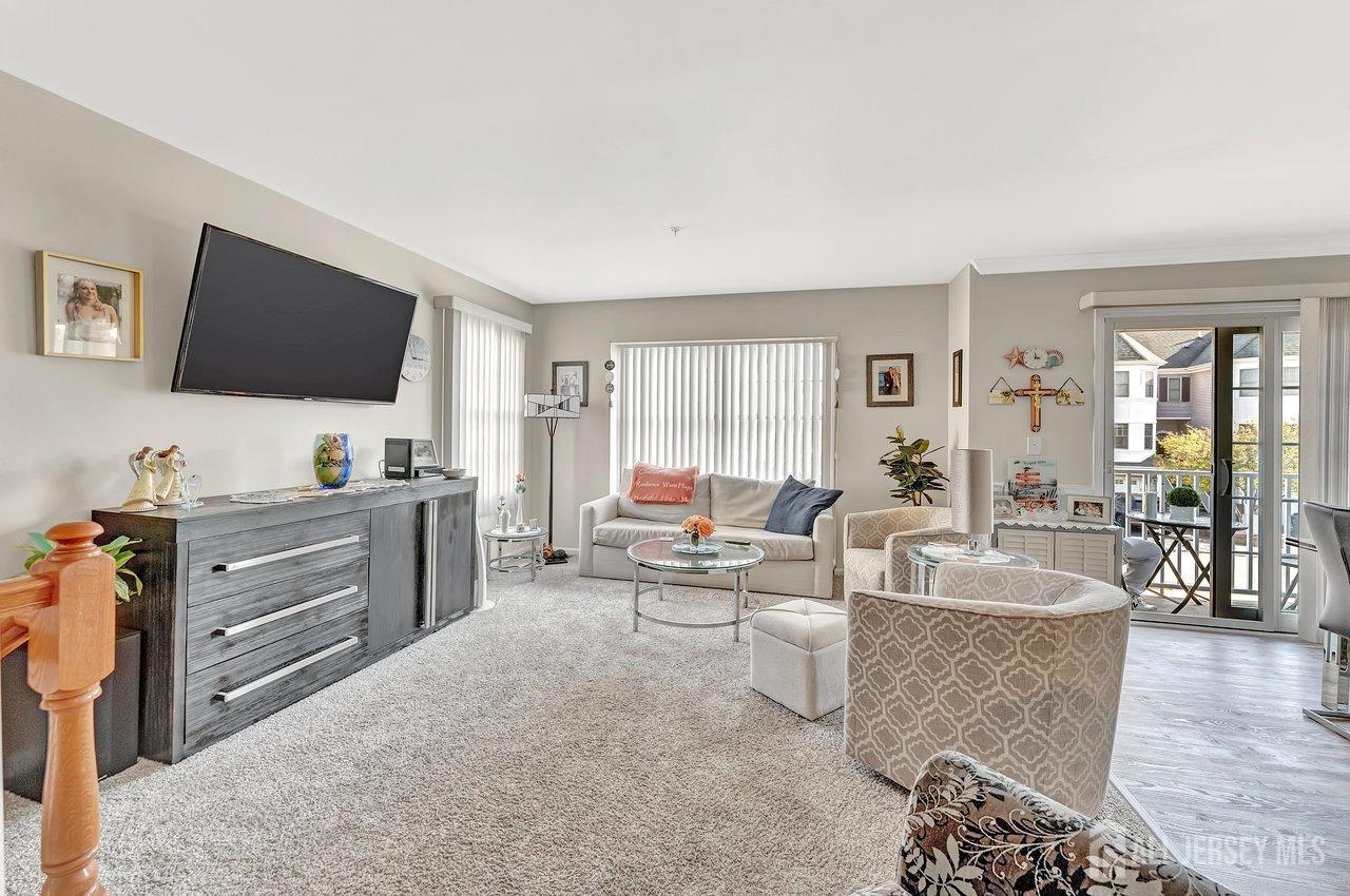6 Raritan Reach Road South Amboy, NJ 08879 - Photo 14 of 31 a living room with furniture and a flat screen tv