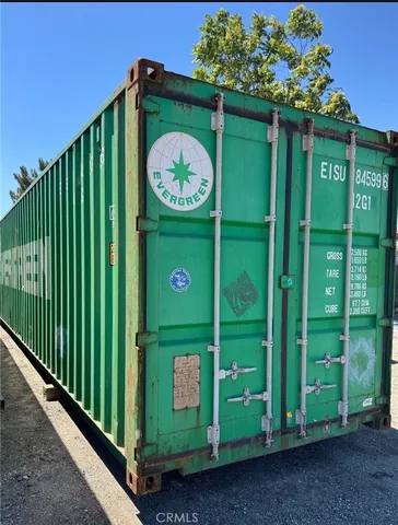 a green sign that is on the side of the road