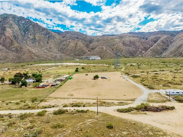 an aerial view of a house with a ocean
